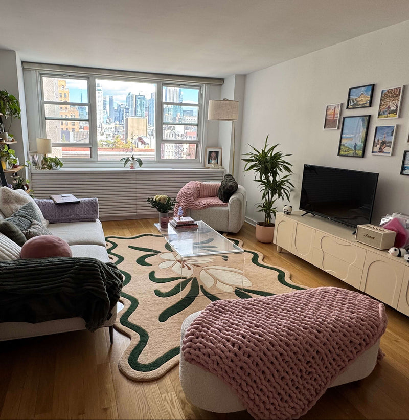 Living room with a city view, furniture, and decor.